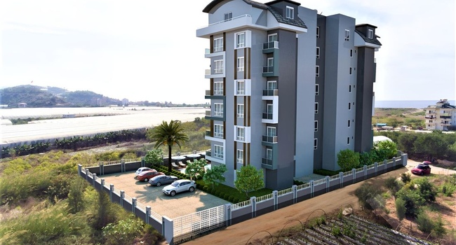 Новый комплекс апартаментов от застройщика в районе Демирташ, 650м к морю, цена:  104 000 € - 192 000 €